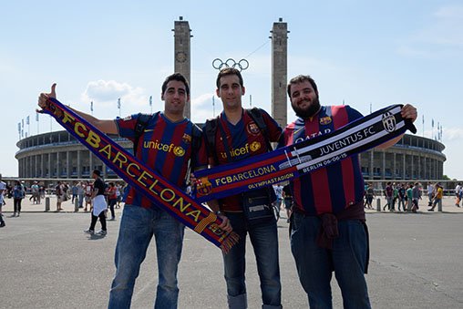 Barcelona fans pose in front of the Olympiastadion.