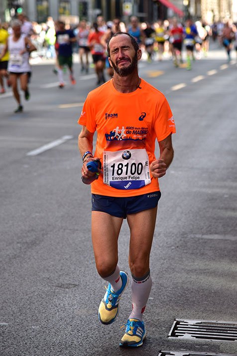 A runner in the Berlin Marathon shows his pain.