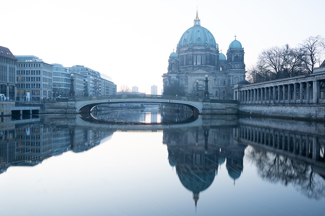 The Museum Island reflected in the Spree.
