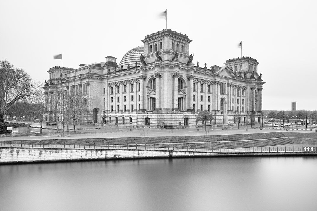 The Reichstag next to the river Spree.