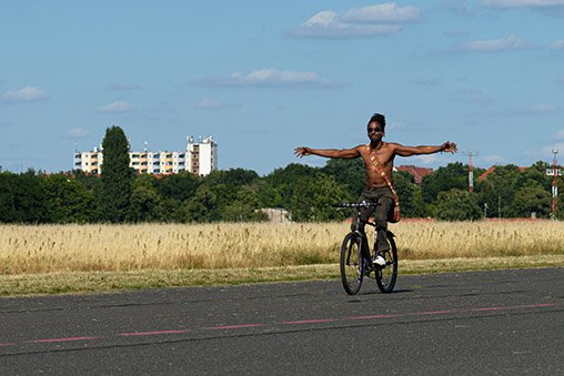 A cyclist on the runway at Tempelhofer Feld.