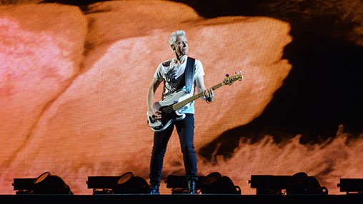 Adam Clayton on stage in Berlin.